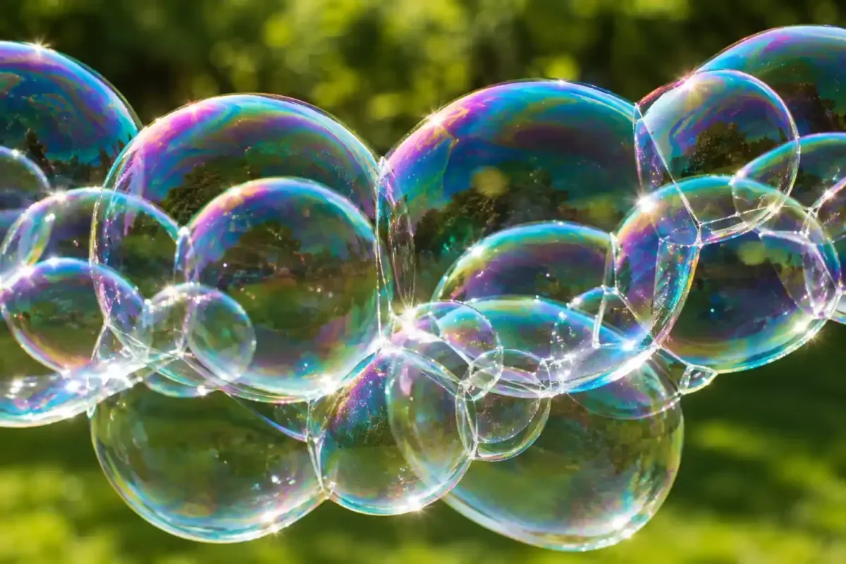 Rainbow colors shining on soap bubbles