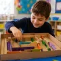 Child Building a Cardboard Marble Maze