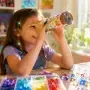 Child looking through a homemade kaleidoscope