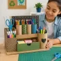 Student Building a Recycled Desk Organizer